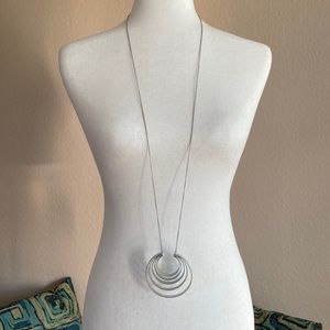 Long silver echo pendant necklace from Anthropologie